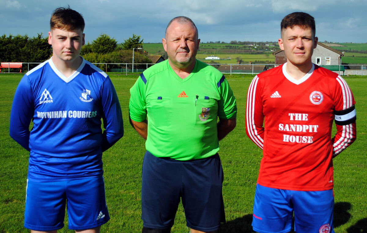 Blackstone Rovers captain Donnacha O'Sullivan with Rathcoole Rovers captain Jimmy Herlihy, accompanied by referee Paul O'Sullivan. Picture: Barry Peelo.