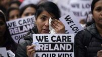 ‘Heartbroken’ migrant health workers protest outside Leinster House