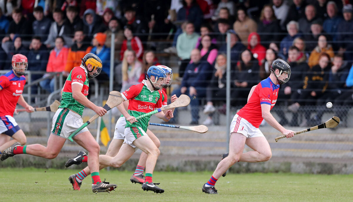  Mark O'Connell, Dripsey, is chased by James Keohane, Liam Lyons and Neil Lordan, Ballinora, in the Muskerry JAHC final in Cloughduv. Picture: Jim Coughlan