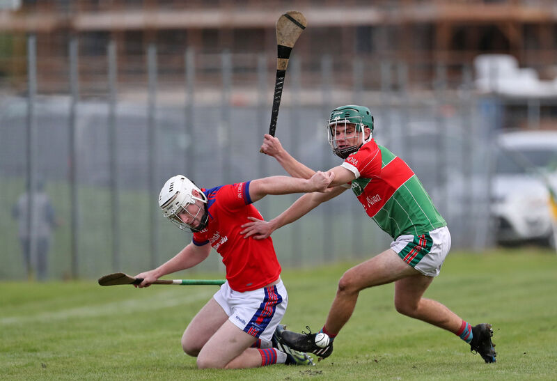  Eoghan Maher, Dripsey, and James Byrne, Ballinora, battling for the ball in the Muskerry JAHC final in Cloughduv. Picture: Jim Coughlan