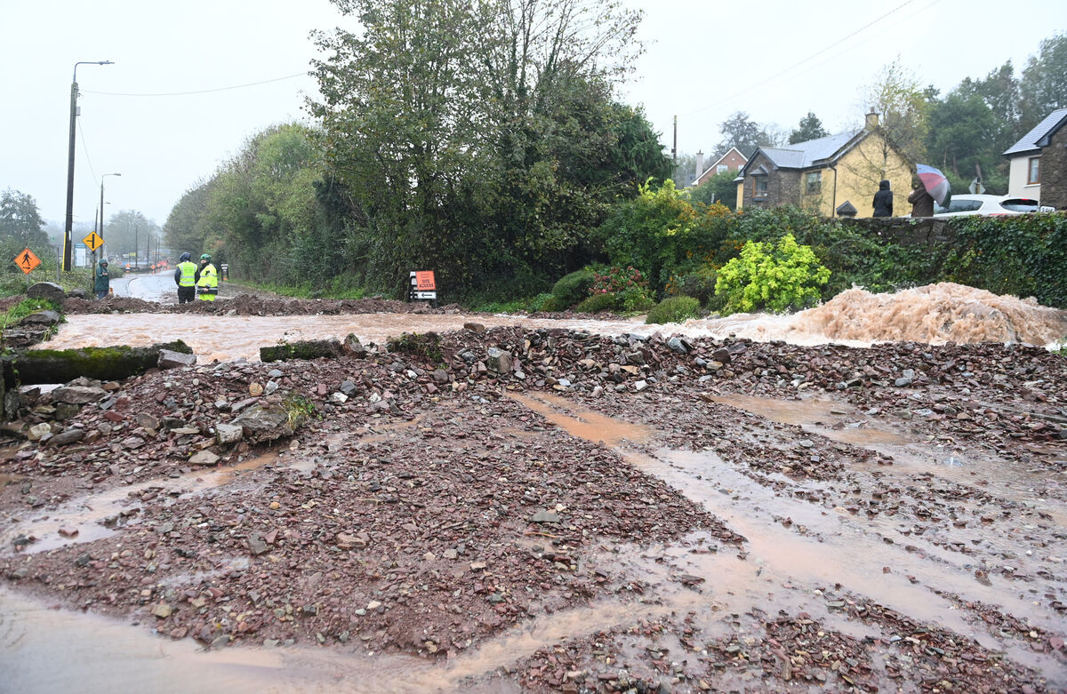 Water pouring across the road in Glanmire Picture; Eddie O'Hare