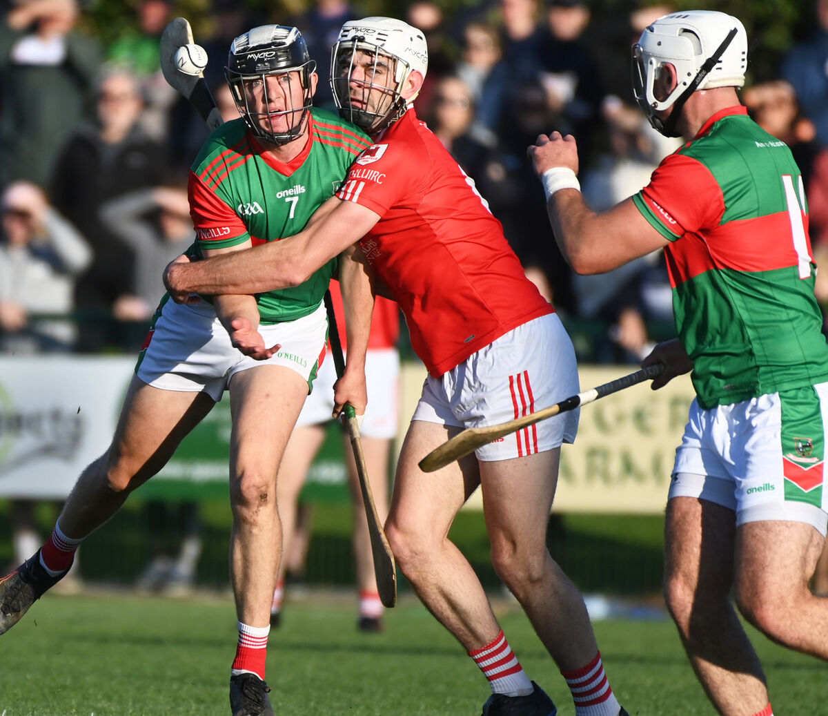 Fr O'Neill's Ger Millerick hand passes to Declan Dalton to score his goal from Charleville's Jack Buckley. Picture; Eddie O'Hare