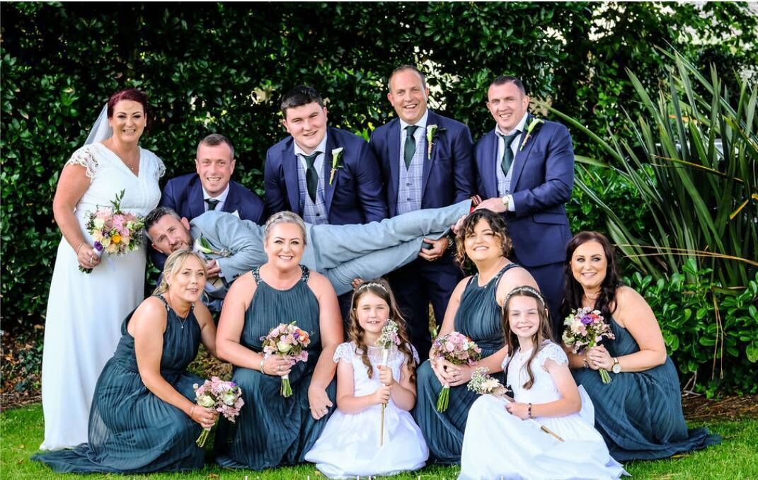 Aine and Mark with their bridal party. Aine and Mark with their bridal party.