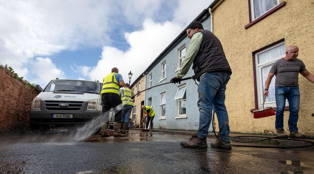  Cleaning up after the floods on Thomas Street, Midleton, Co Cork; Picture Dan Linehan