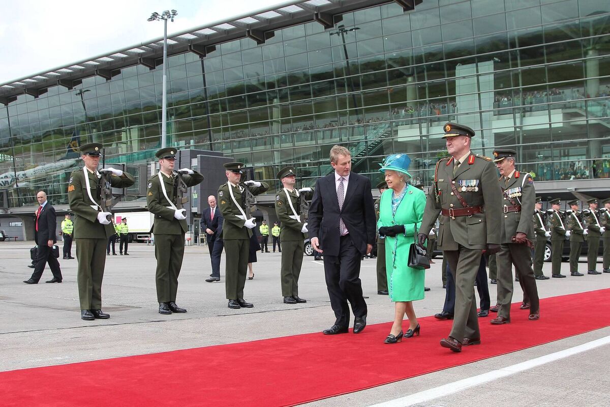 Then Taoiseach Enda Kenny TD, the late Queen Elizabeth II and Lt Gen Séan McCann, then Chief of Staff of the Defence Forces inspecting a guard of honour before departing from Cork Airport after the four day State Visit to Ireland. Maxwells/PA Wire