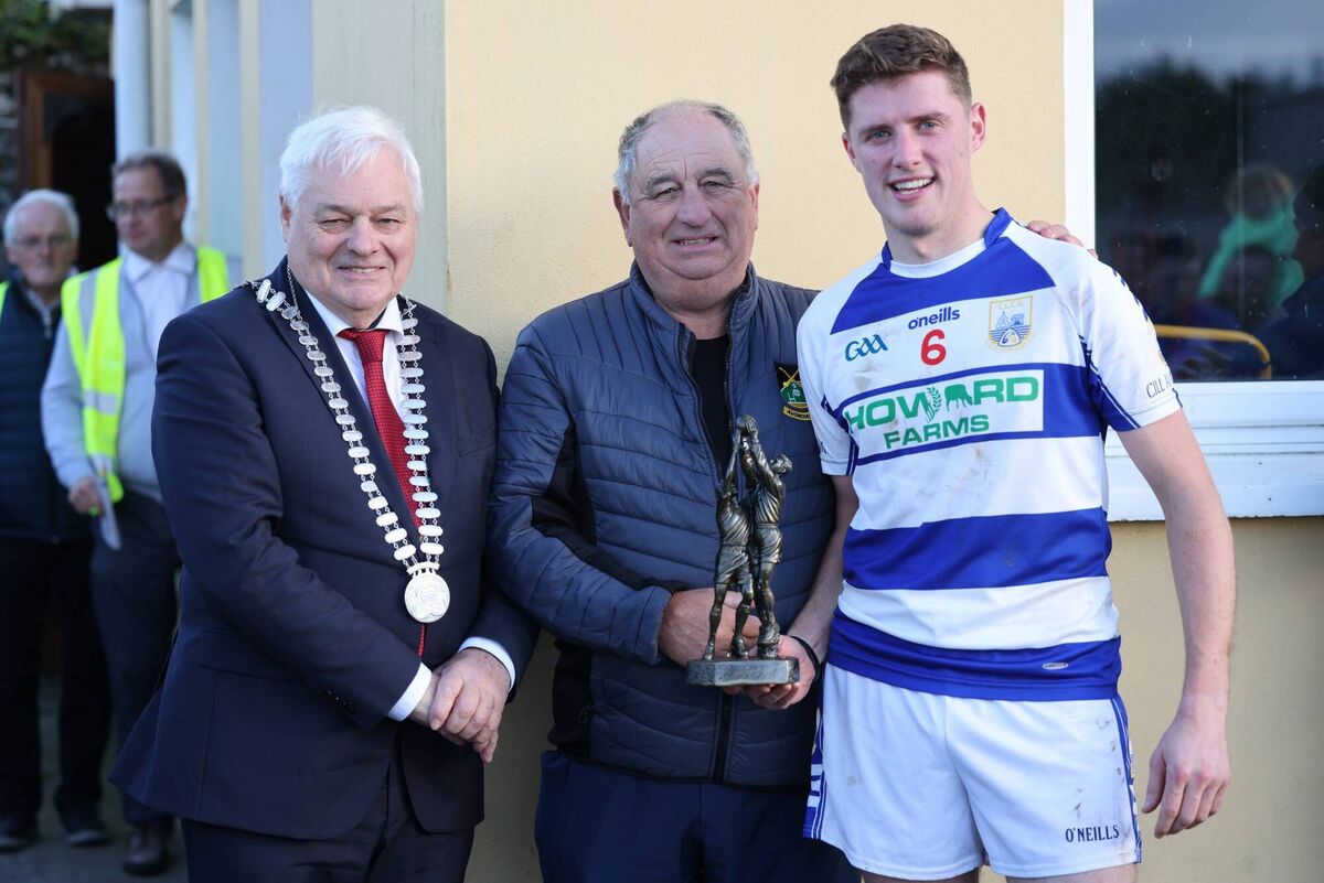 Liam Cronin, Killavullen, man of the match is presented with his award by Arthur O'Keeffe, Chairman and Frank O'Flynn, County Mayor. Picture: John Hannon