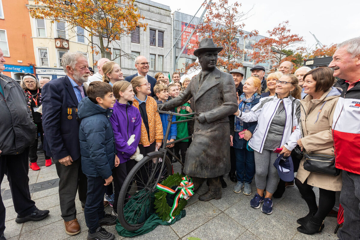 Members of the public and Simon Coveney TD, Minister for Enterprise, Trade and Employment of Ireland at the unveiling of a new statue of Michael Collins on Grand Parade, Cork. Picture: Darragh Kane