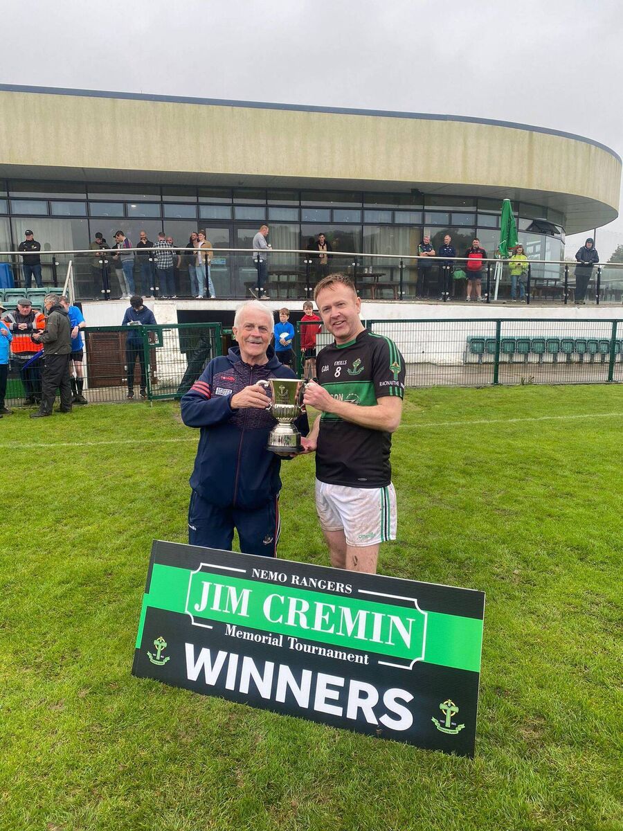 Nemo Rangers captain Paul Hogan was presented with the cup by Denis Cremin a brother of Nemo Rangers club stalwart Jim Cremin.