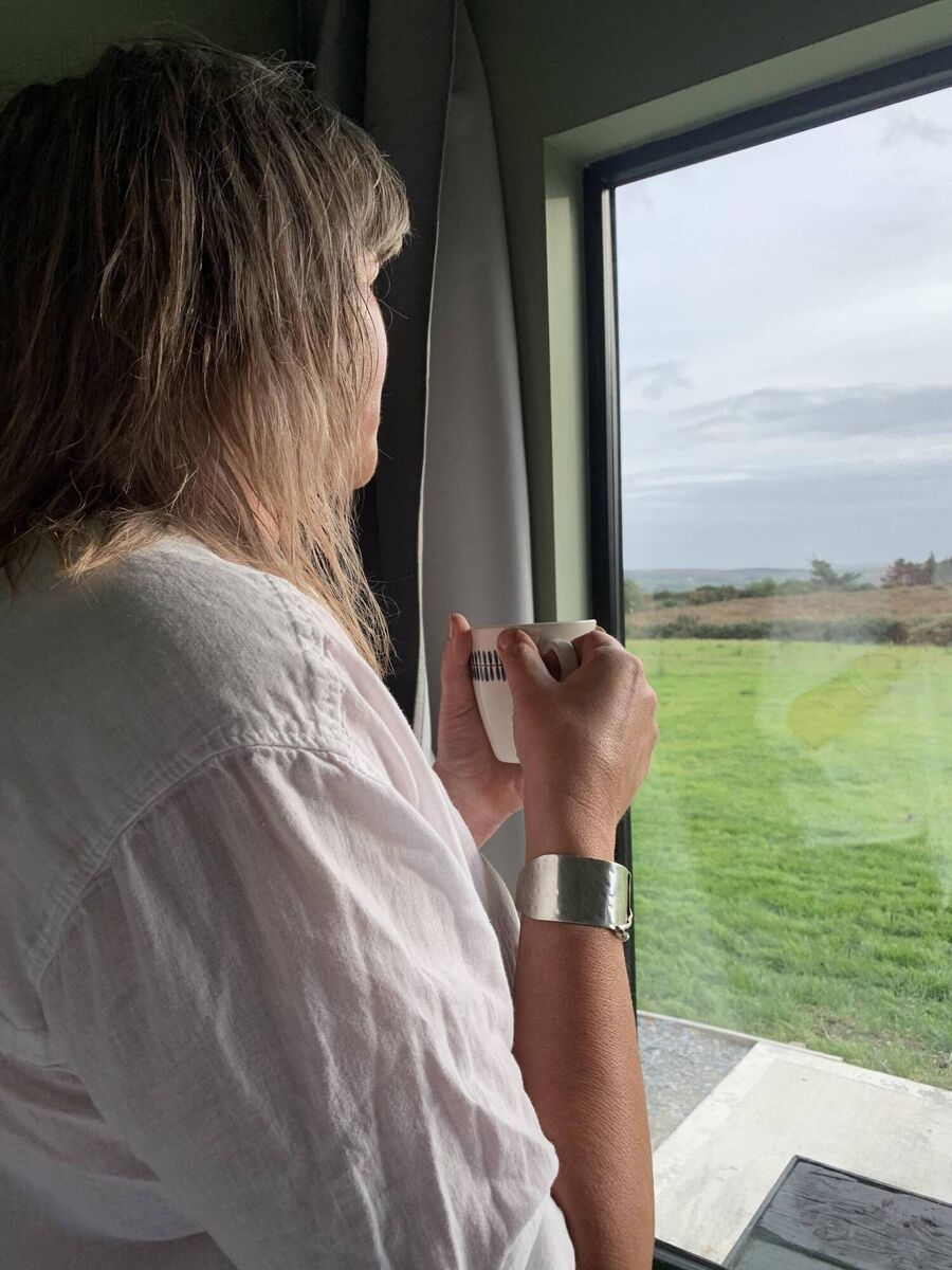 Amy looking out over the stunning views at Wild Hideaways, Laharanshermeen, Bantry.