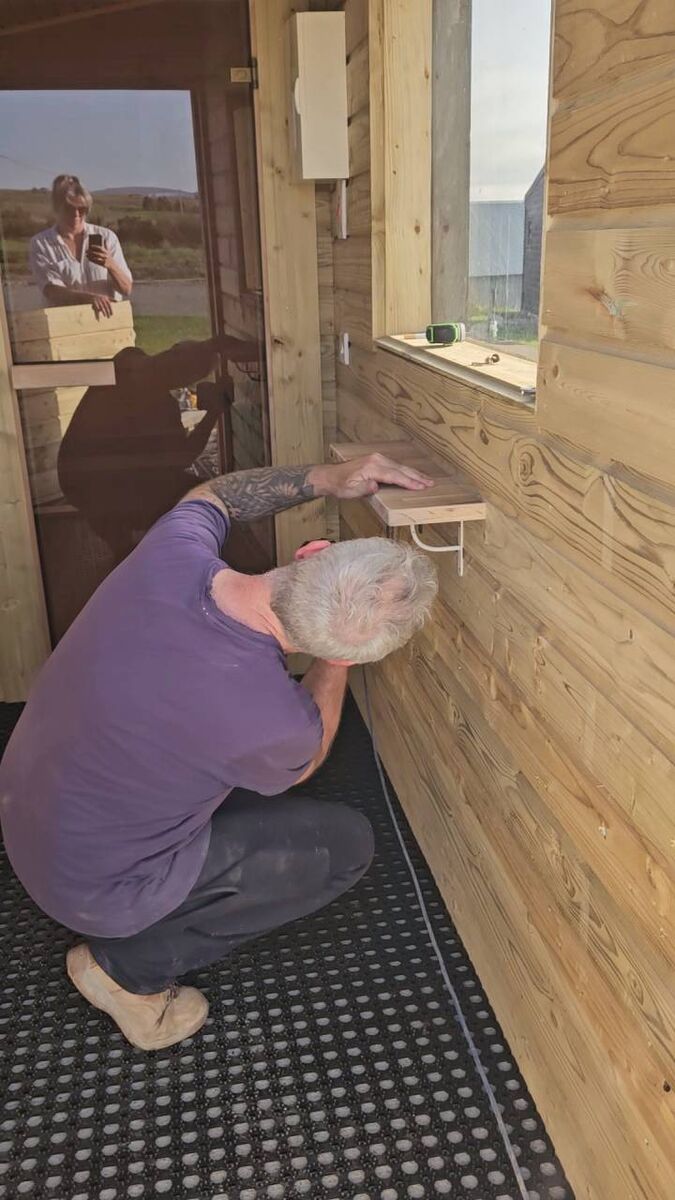 John, hard at work on one of the lodges.