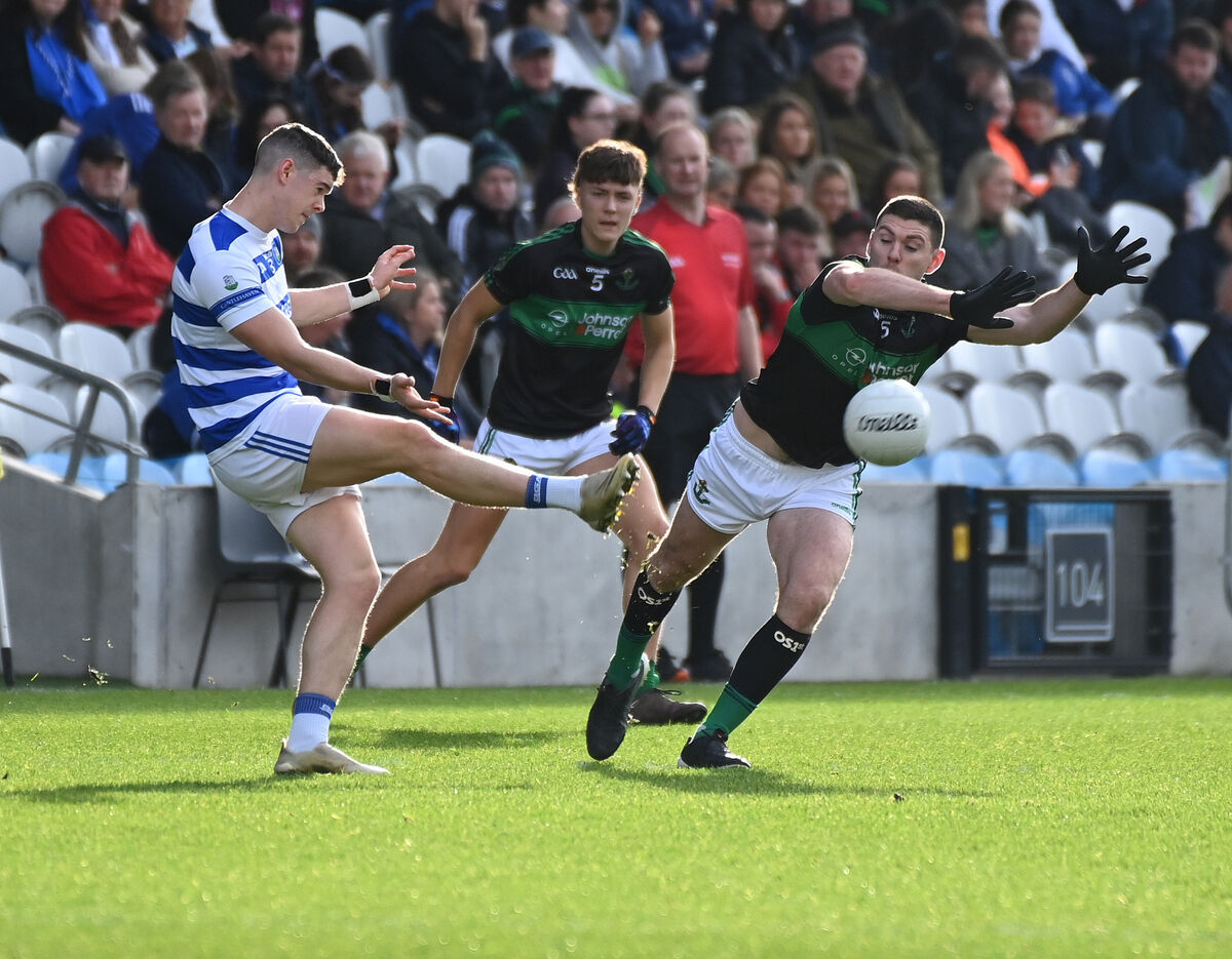 Castlehaven's Rory Maguire clears past Nemo Rangers Luke Connolly. Picture: Eddie O'Hare