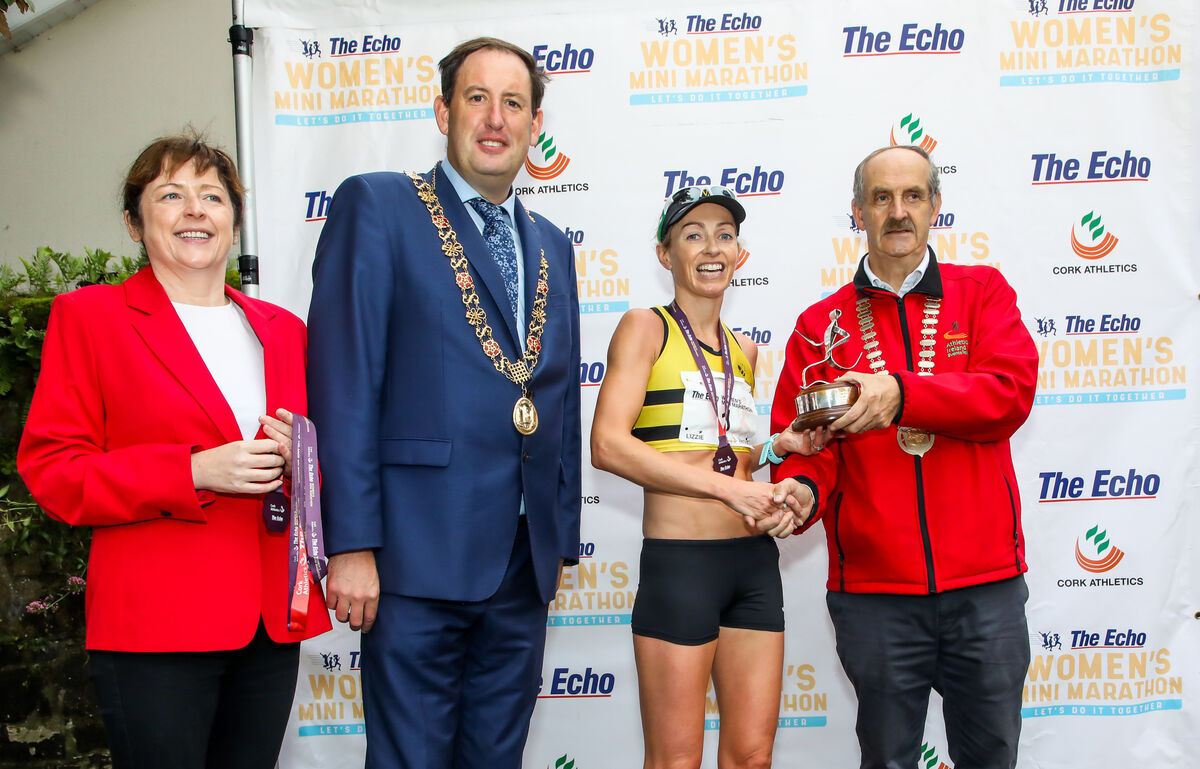 Grainne McGuinness, Editor Echo, Lord Mayor of Cork, Cllr. Kieran McCarthy, Lizzie Lee, winner and Pat Walsh, AAI at the prentation to the winner of the 42nd Echo Cork Women's Mini-Marathon in Cork City. - Picture: David Creedon
