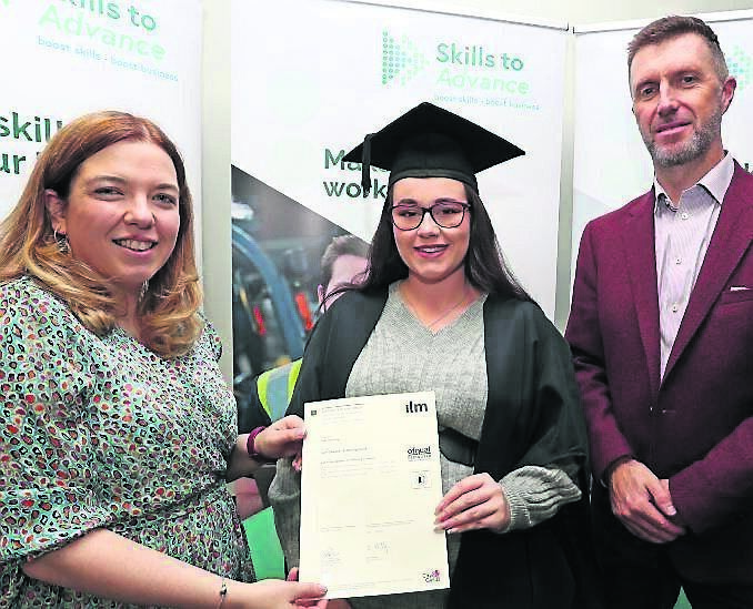 Niamh Gaine presenting Urla Coomey with her certificate. Also included is Charlie Dineen, HR director The Fota Collection.