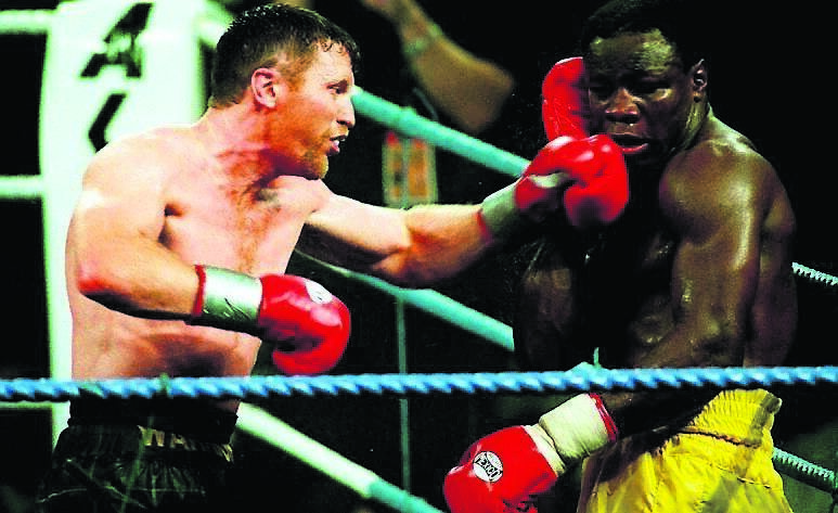 Steve Collins lands a punch on Chris Eubank during the fight in Millstreet in 1995