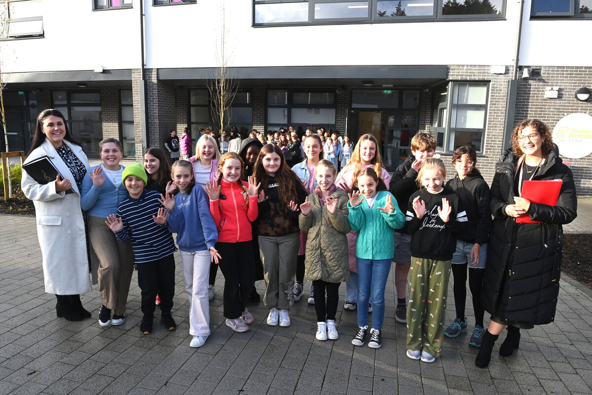  Teachers Siobhan Nyhan and Holly Dwyer with choir singers who sung for arriving guests. Picture: Larry Cummins