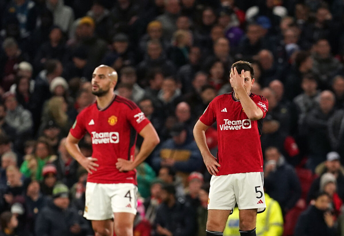 Manchester United's Sofyan Amrabat and Harry Maguire reacts after Newcastle United's Joe Willock (not pictured) scores their side's third goal of the game during the Carabao Cup fourth round match at Old Trafford, Manchester. Picture: Martin Rickett/PA Wire.