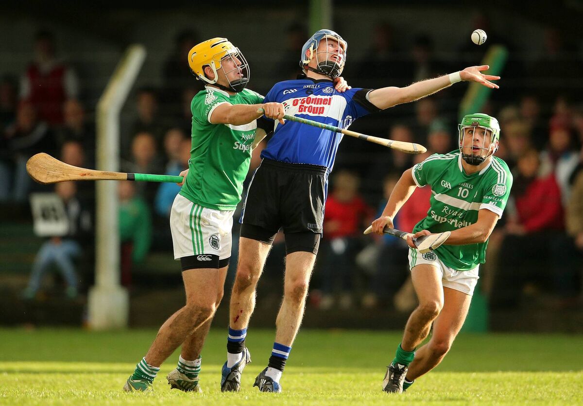 Kilmallock's Jake Mulcahy and Robbie Hanley with Ray Ryan. Picture: INPHO/Cathal Noonan Kilmallock's Jake Mulcahy and Robbie Hanley with Ray Ryan. Picture: INPHO/Cathal Noonan
