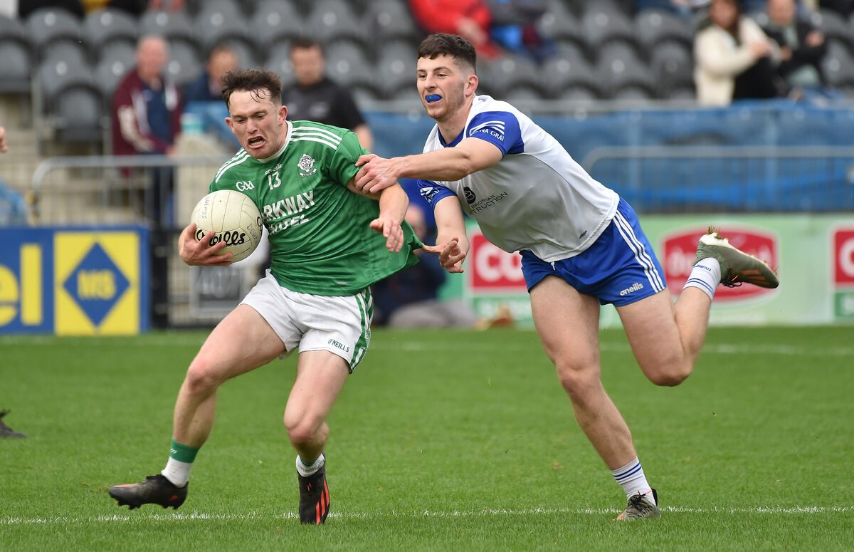  Keith White, Dohenys, is tackled by Timmy O'Connor, Knocknagree, during the SAFC semi-final. Picture: Dan Linehan