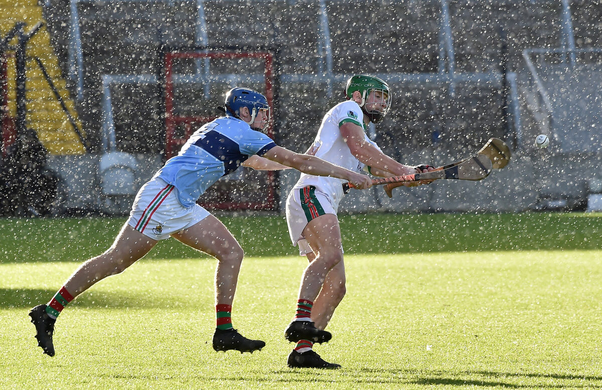 Kevin Murphy, Ballinora, getting his shot on goal away despite the attention of David O'Sullivan, Clonakilty. Picture: Dan Linehan Kevin Murphy, Ballinora, getting his shot on goal away despite the attention of David O'Sullivan, Clonakilty. Picture: Dan Linehan