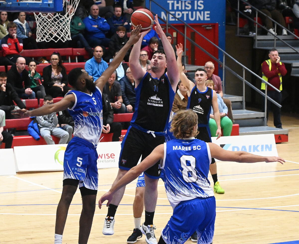 UCC Demon's David Lehane shoots from Maree's Kyle Carey and Tom Dumont during the Pat Duffy Men's National cup at the Neptune stadium. Picture; Eddie O'Hare