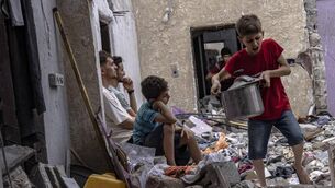 <p class="contextmenu internal_Caption">Palestinians inspect the rubble of a house after it was struck by an Israeli airstrike in Khan Younis in Gaza. AP Photo/Fatima Shbair</p>