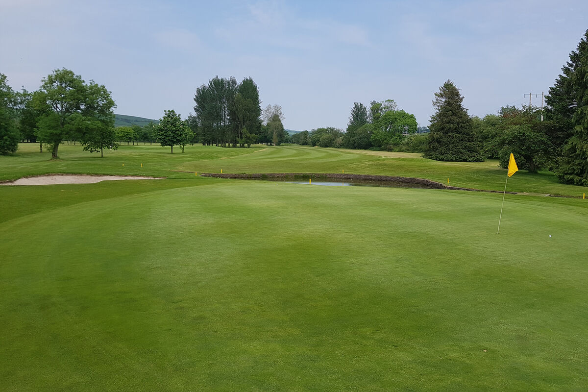  The 12th green in East Cork Golf Club with water and sand to catch any loose approach shots.