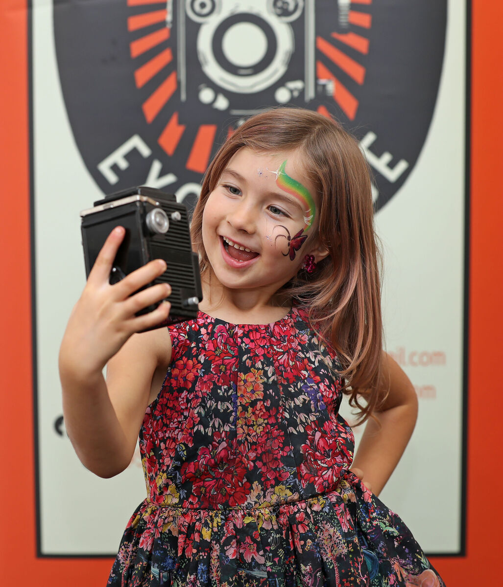 Anna Rose Marbe with one of her late dad, Hermann's, cameras.