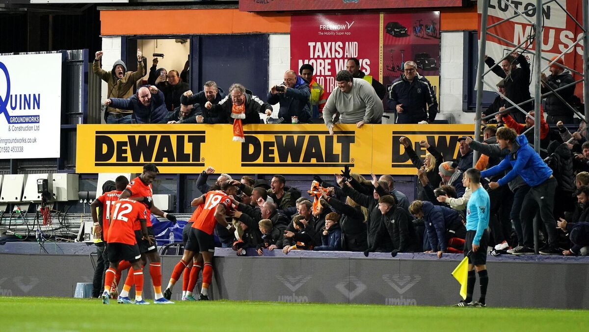 Luton Town's Tahith Chong (hidden) celebrates scoring their side's goal in the  Premier League match against at Kenilworth Road, Luton. Picture: Zac Goodwin/PA Wire