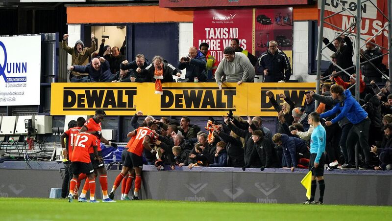 Luton Town's Tahith Chong (hidden) celebrates scoring their side's goal in the  Premier League match against at Kenilworth Road, Luton. Picture: Zac Goodwin/PA Wire