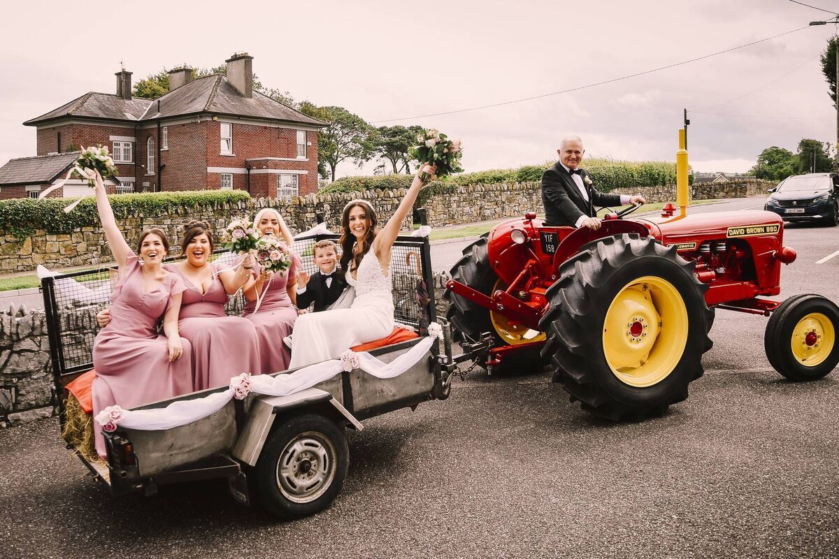 One of the highlights of the day was when the bride and her bridal party were brought by her dad Michael Hegarty to the church on his ‘David Brown 880 Selectamatic’ vintage tractor - his pride and joy. One of the highlights of the day was when the bride and her bridal party were brought by her dad Michael Hegarty to the church on his ‘David Brown 880 Selectamatic’ vintage tractor - his pride and joy.