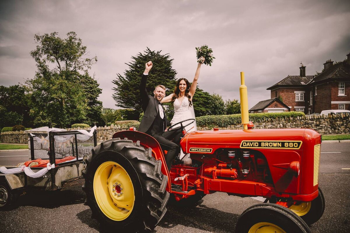 The happy couple travelling in style on her dad’s vintage tractor. The couple first met on dating app Bumble and hit it off when they realised they both liked the Irish pub Mulligans in Manchester. The happy couple travelling in style on her dad’s vintage tractor. The couple first met on dating app Bumble and hit it off when they realised they both liked the Irish pub Mulligans in Manchester.