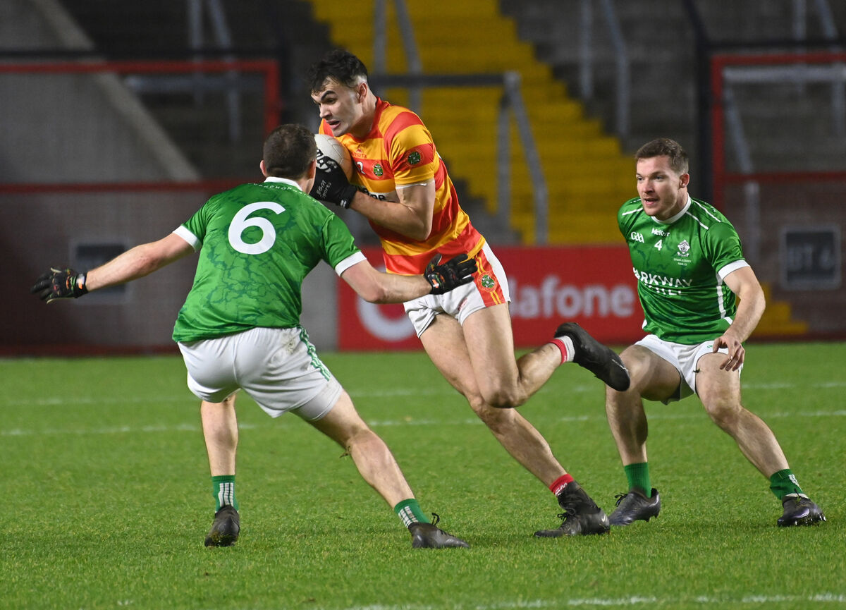 Newcestown's Sean O'Donovan breaking between Dohenys' Eoin Lavers and Donal Rice. Picture: Eddie O'Hare