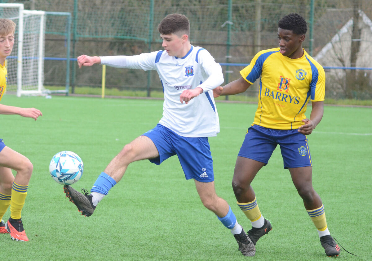 Cathal Daunton of Leeds controls the ball ahead of Douglas Hall's Golding Nduwuba during the U17 Premier league match at Moneygourney. Pictiure: Howard Crowdy