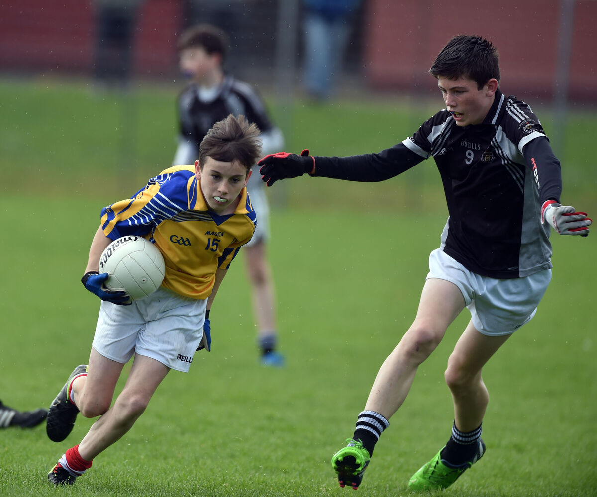 De la Salle, Macroom's Ian Jones gets away from Rochestown College's Josh Honohan during an U14 final in Ballincollig. Picture: Eddie O'Hare