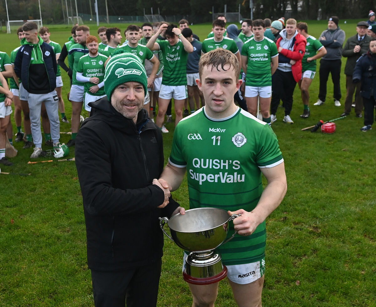 Derry Casey, Farho Heating presents Ballincollig captain Mark Oldham with the trophy. Picture: Eddie O'Hare Derry Casey, Farho Heating presents Ballincollig captain Mark Oldham with the trophy. Picture: Eddie O'Hare