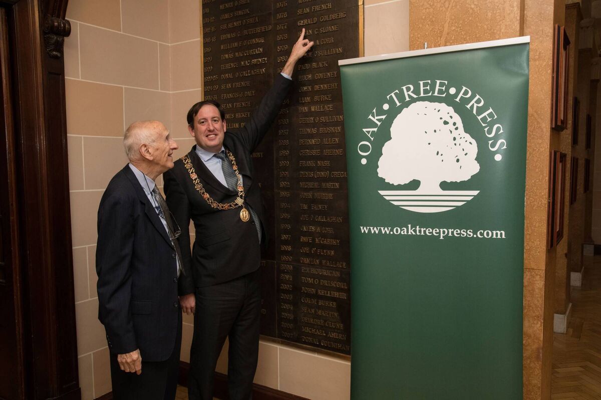 David Goldberg and Cllr Kieran McCarthy, Lord Mayor of Cork City, pointing out David’s father’s name on the list of Lords Mayor at the launch of his book, ‘Gerald &amp; Sheila Goldberg of Cork: A Son’s Perspective’. Picture: Rob Lamb