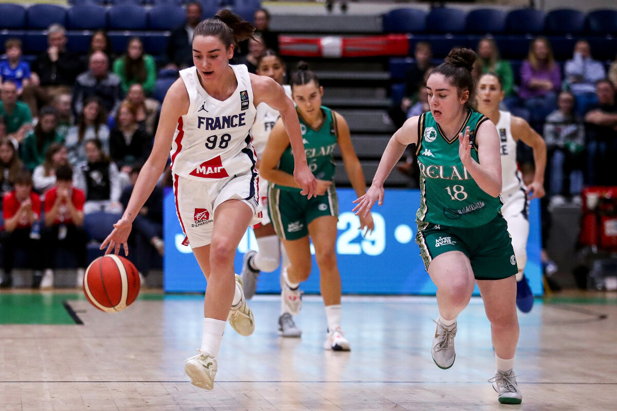 France's Pauline Astier runs down up the court with Annaliese Murphy of Ireland. Picture: INPHO/Ben Brady