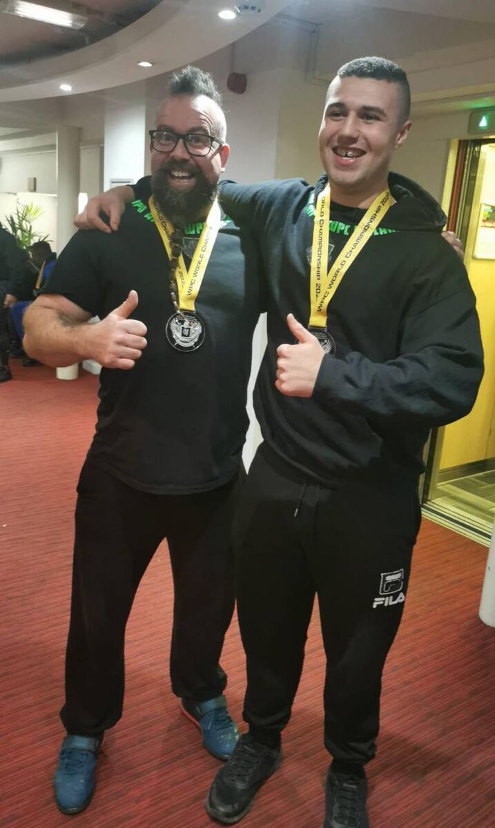Tommy Collins and Matthew Batista of TK Fitness with their world championship medals.