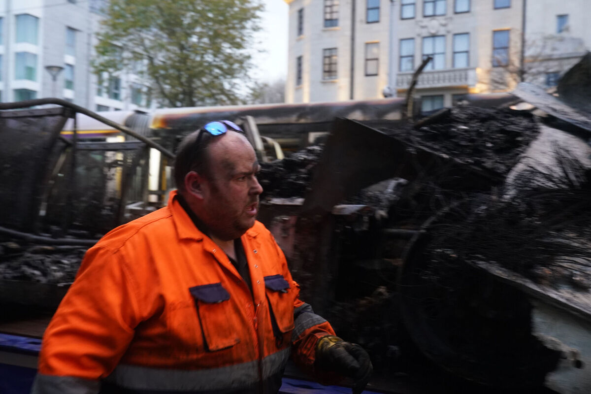 A worker removes a burned out Luas from O'Connell Street in Dublin, in the aftermath of violent scenes in the city centre on Thursday evening. The unrest came after an attack on Parnell Square East where five people were injured, including three young children. Photo: Brian Lawless/PA Wire A worker removes a burned out Luas from O'Connell Street in Dublin, in the aftermath of violent scenes in the city centre on Thursday evening. The unrest came after an attack on Parnell Square East where five people were injured, including three young children. Photo: Brian Lawless/PA Wire