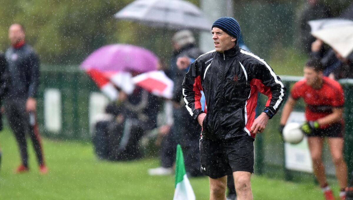 Éire Óg coach Paudie Kissane braves the wet weather against Béal Átha'n Ghaorthaidh. Picture: Eddie O'Hare