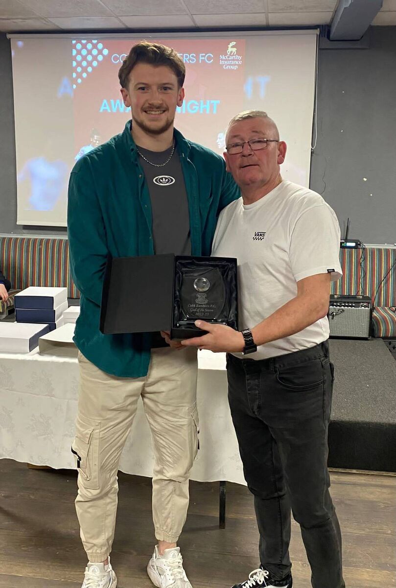Cobh Ramblers club ambassador "Handsome" Bob Donovan (right) presenting Matthew McKevitt (left) with his Goal of the Season award. Cobh Ramblers club ambassador "Handsome" Bob Donovan (right) presenting Matthew McKevitt (left) with his Goal of the Season award.