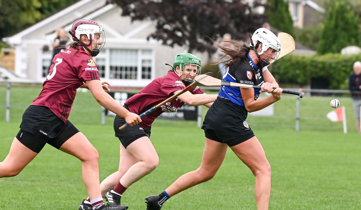 Sarsfields' Hollie Herlihy scores a fine goal despite the efforts of Enniskeane's Emma O'Driscoll and Celine Nyhan, during their SE Systems Senior Camogie Championship clash, at Castle Road. Sarsfields' Hollie Herlihy scores a fine goal despite the efforts of Enniskeane's Emma O'Driscoll and Celine Nyhan, during their SE Systems Senior Camogie Championship clash, at Castle Road.