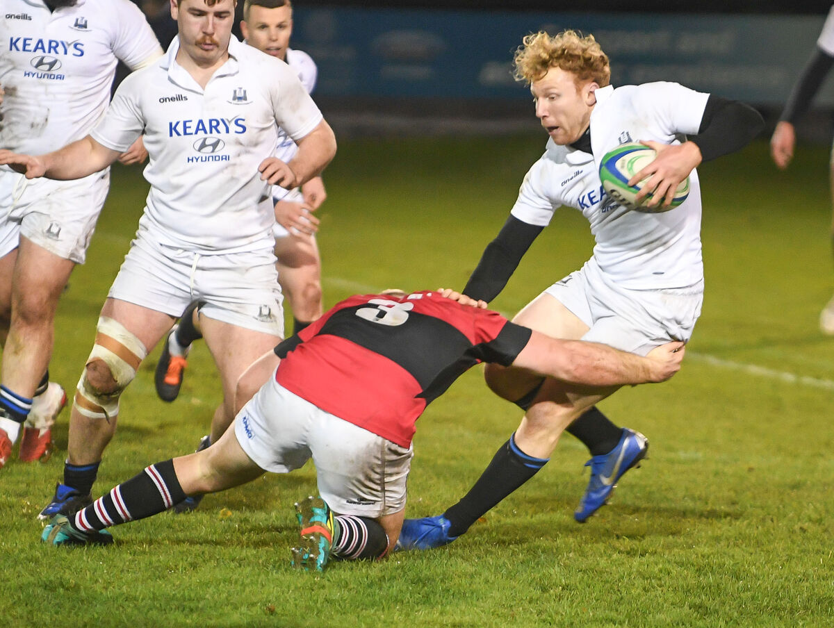  Cork Constitution's Robert Jermyn tries to evade the tackle of UCC's Bryan O'Connor. Picture: David Keane.