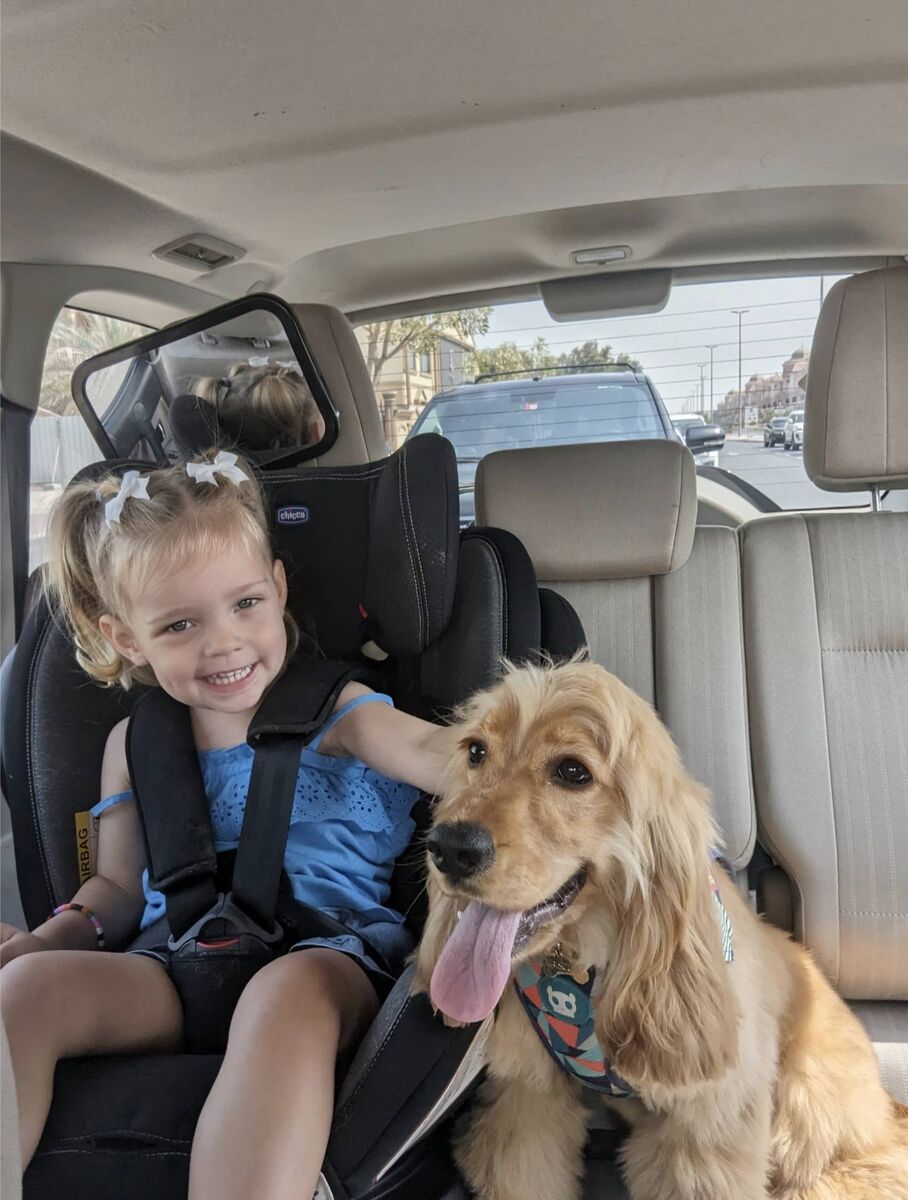 Elodie who is 2 years old and dog, Biscuit. Elodie who is 2 years old and dog, Biscuit.