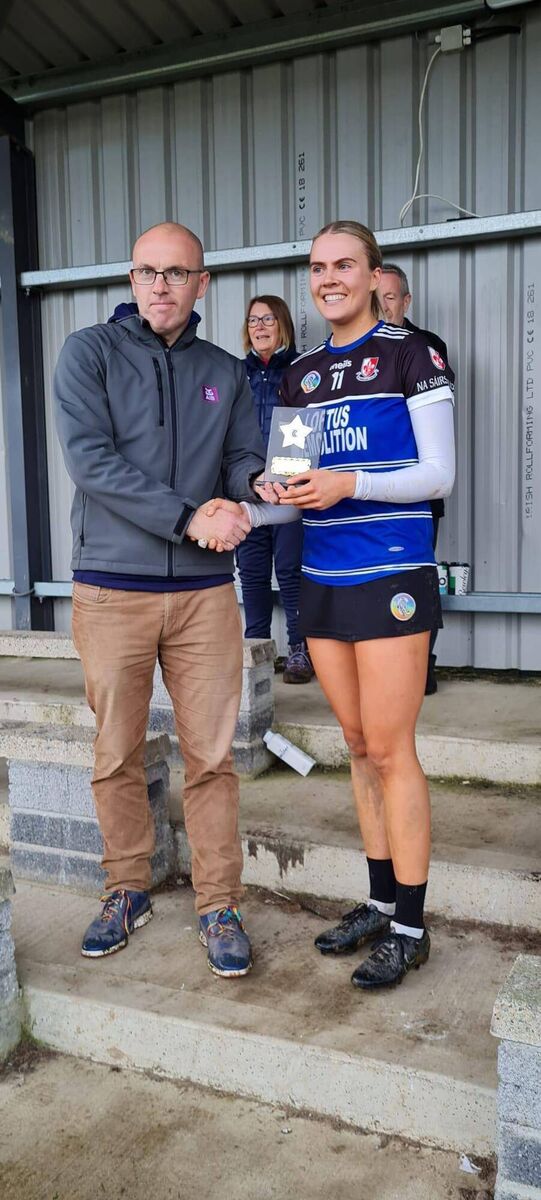 Padraig Butler of AIB presents Sarsfields Lucy Allen with the Player of the Match Award