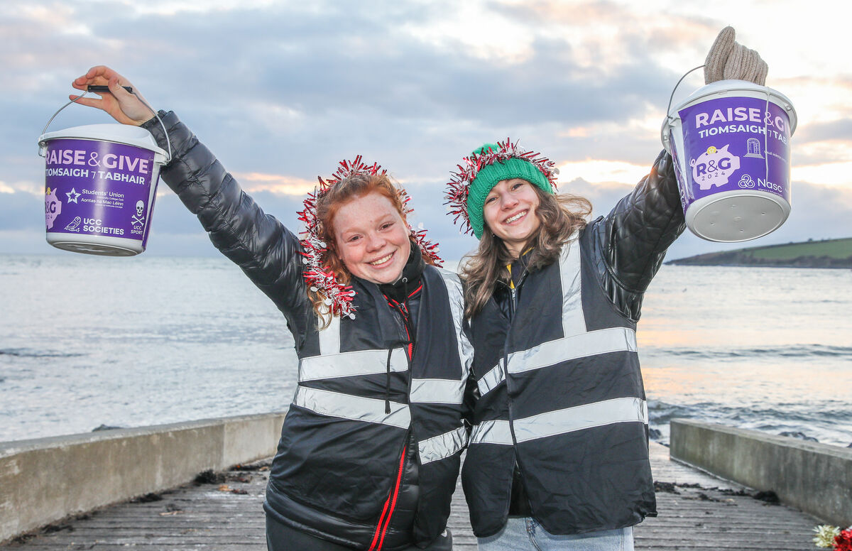 Rhona Lennox and Nessa Wheeler collecting for charity at the UCC College Christmas Swim organised by the Students Union to raise funds for various charities at Fountainstown, Co. Cork. - Picture: David Creedon