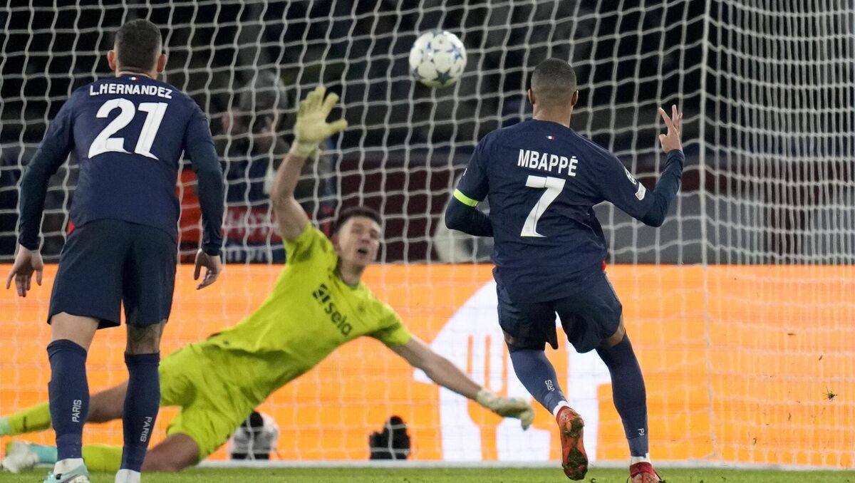 PSG's Kylian Mbappe, right, scores his side's goal from the penalty spot during the Champions League group F soccer match against Newcastle United at the Parc des Princes in Paris, Tuesday, Picture: AP Photo/Christophe Ena