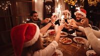 friends toasting at home for christmas