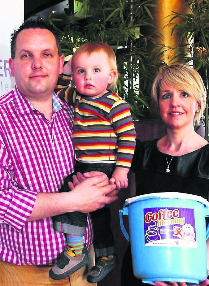 Alan Burke, 19-month-old Harry and mum and organiser Lucy Wolfe at a charity fundraising event some years ago. Pic; Larry Cummins