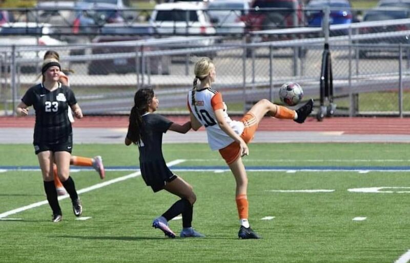 Olivia Gibson in action for her college.